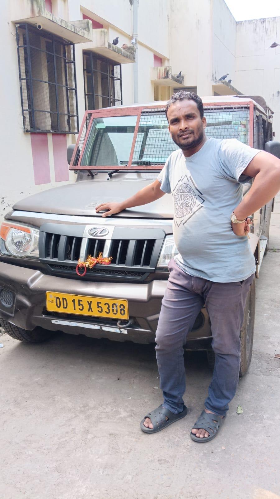 S.S. Agency field officer with patrol vehicle